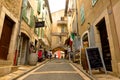 Narrow shopping street in medieval village of Valbonne, Provence, France